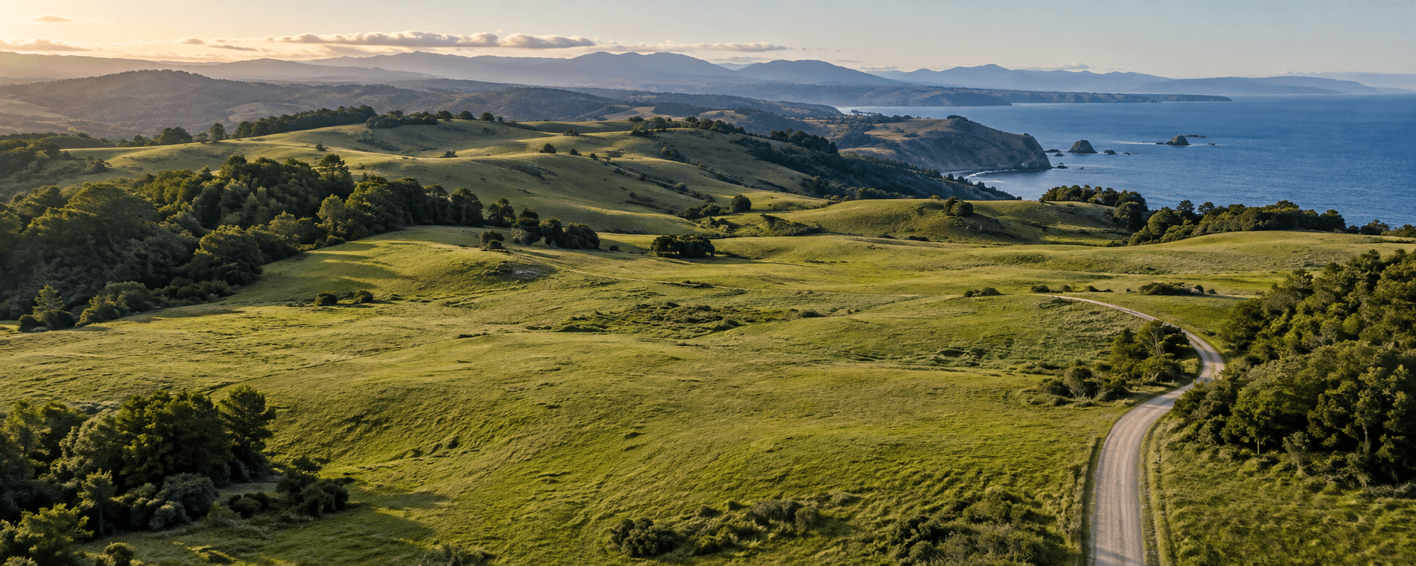 Illustrative open coastal land with a winding access road